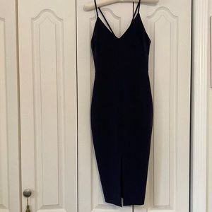 Gorgeous navy blue slim fitting dress.  Looks absolutely beautiful on.  Size 0